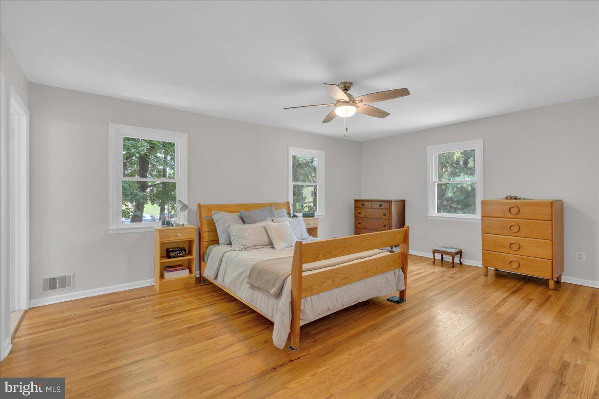 298 North Post Road Princeton Junction, NJ 08550 - Photo 17 of 35 a spacious bedroom with a bed and wooden floor