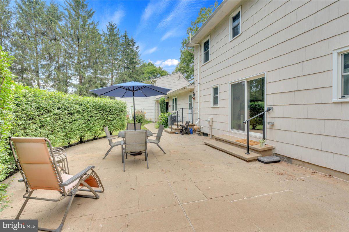 298 North Post Road Princeton Junction, NJ 08550 - Photo 28 of 35 a view of a patio with a table and chairs under an umbrella