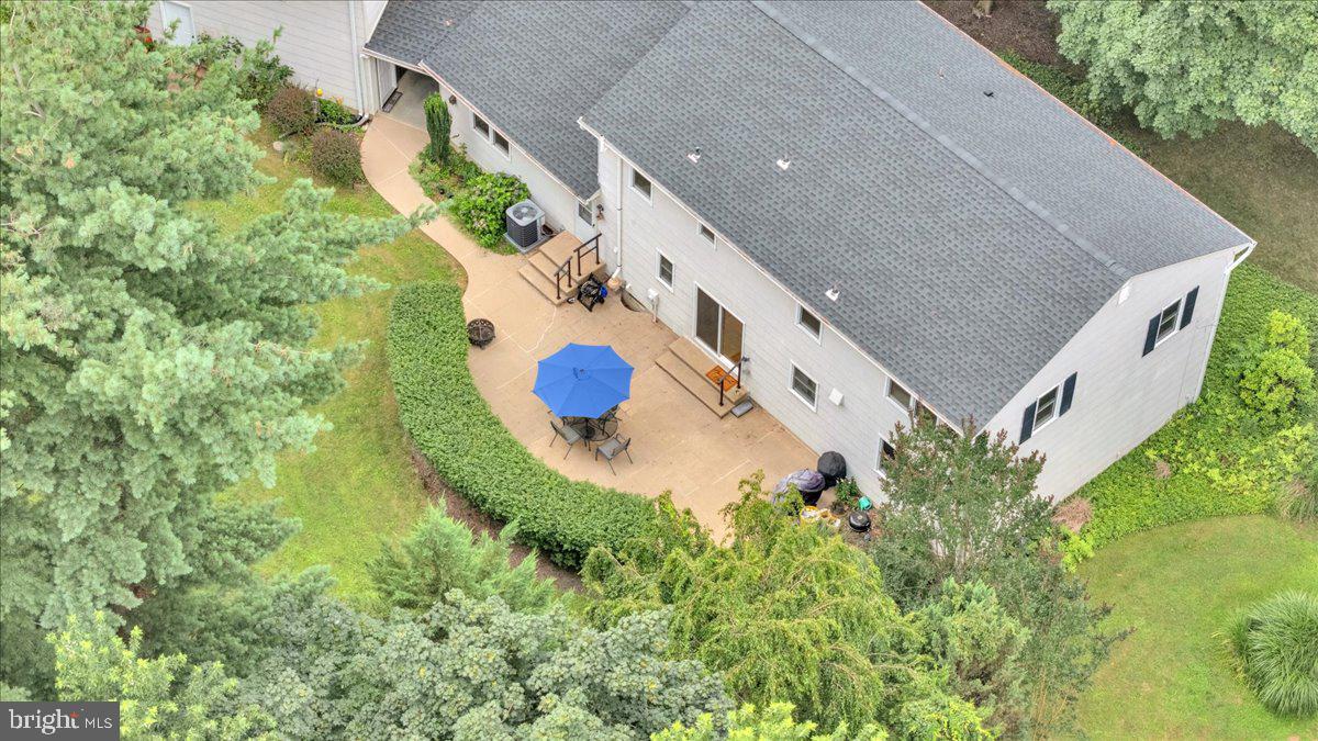 298 North Post Road Princeton Junction, NJ 08550 - Photo 33 of 35 an aerial view of a house with a swimming pool and large trees