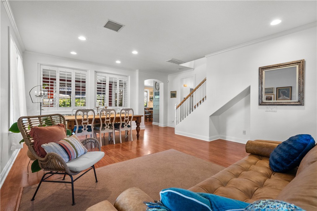 26214 Reade Place Stevenson Ranch, CA 91381 - Photo 12 of 58 a living room with furniture and wooden floor