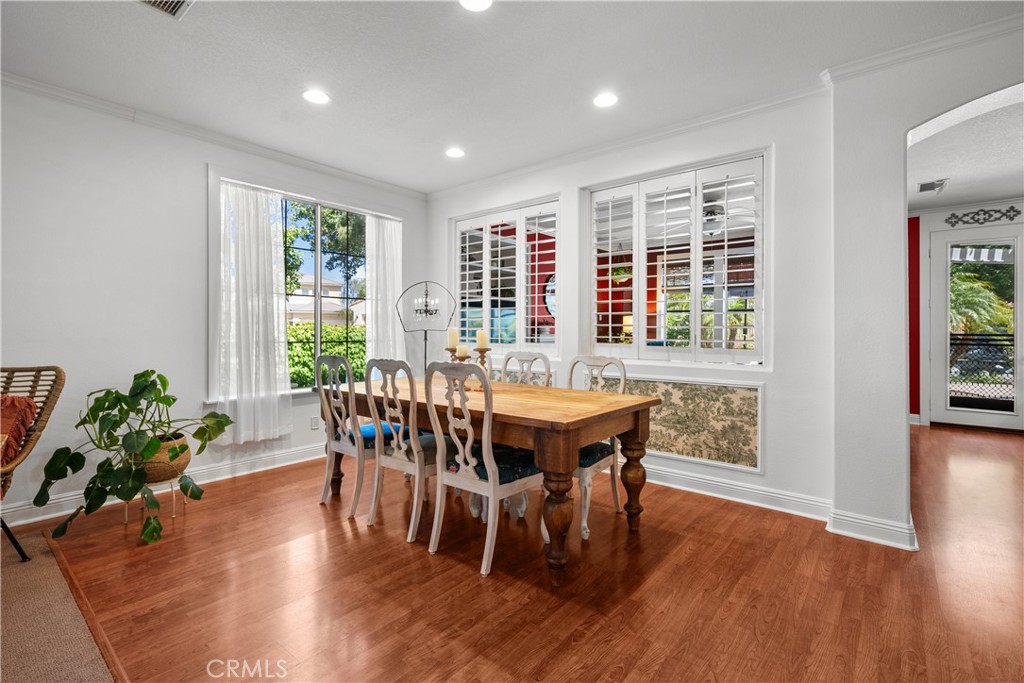 26214 Reade Place Stevenson Ranch, CA 91381 - Photo 13 of 58 a view of a dining room with furniture window and wooden floor