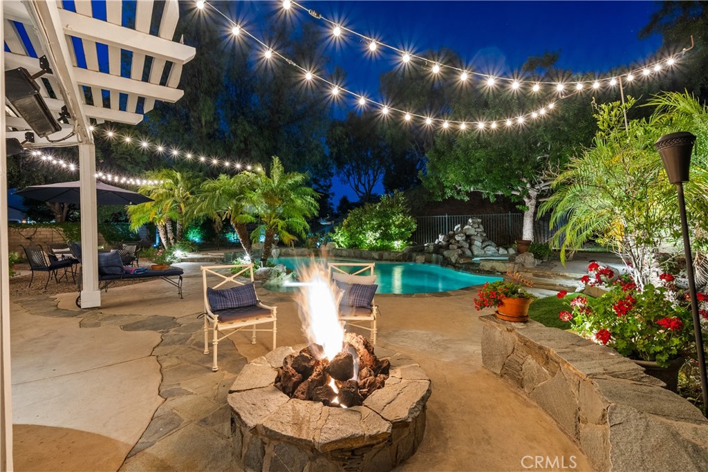 26214 Reade Place Stevenson Ranch, CA 91381 - Photo 27 of 58 a view of a chairs and tables in the patio in front of a house