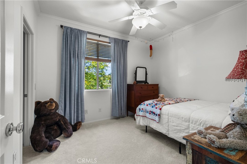 26214 Reade Place Stevenson Ranch, CA 91381 - Photo 39 of 58 a bedroom with a bed and a window