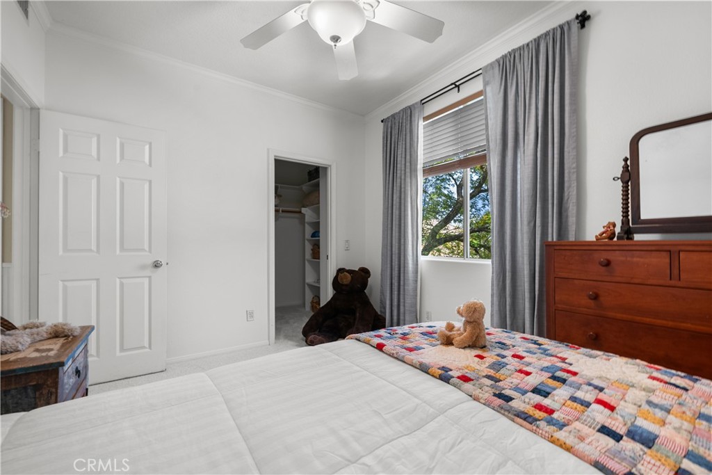 26214 Reade Place Stevenson Ranch, CA 91381 - Photo 40 of 58 a bedroom with a bed and wooden floor