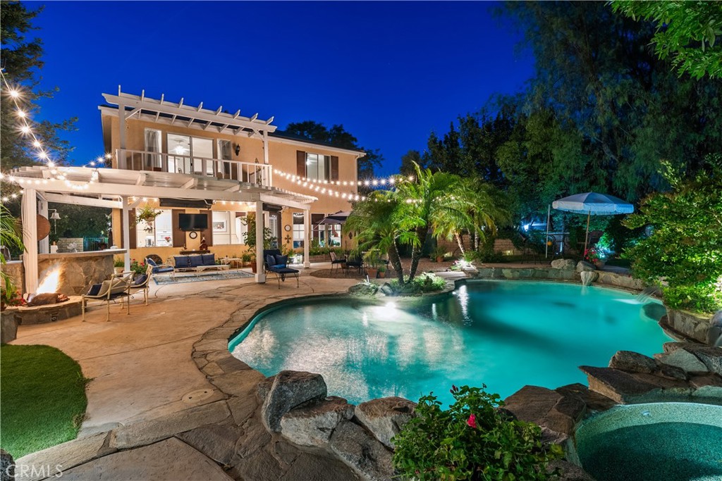 26214 Reade Place Stevenson Ranch, CA 91381 - Photo 4 of 58 a view of a swimming pool with sitting area