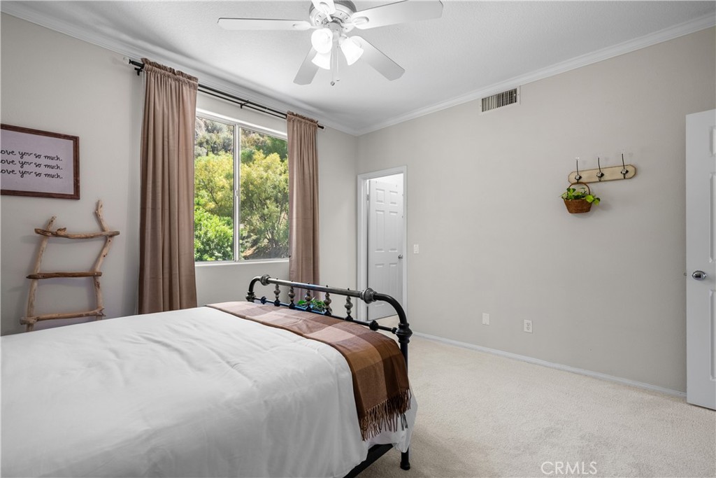 26214 Reade Place Stevenson Ranch, CA 91381 - Photo 42 of 58 a bedroom with a bed and a window