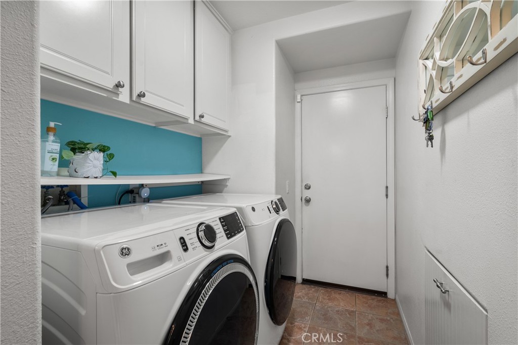 26214 Reade Place Stevenson Ranch, CA 91381 - Photo 48 of 58 a utility room with dryer and washer