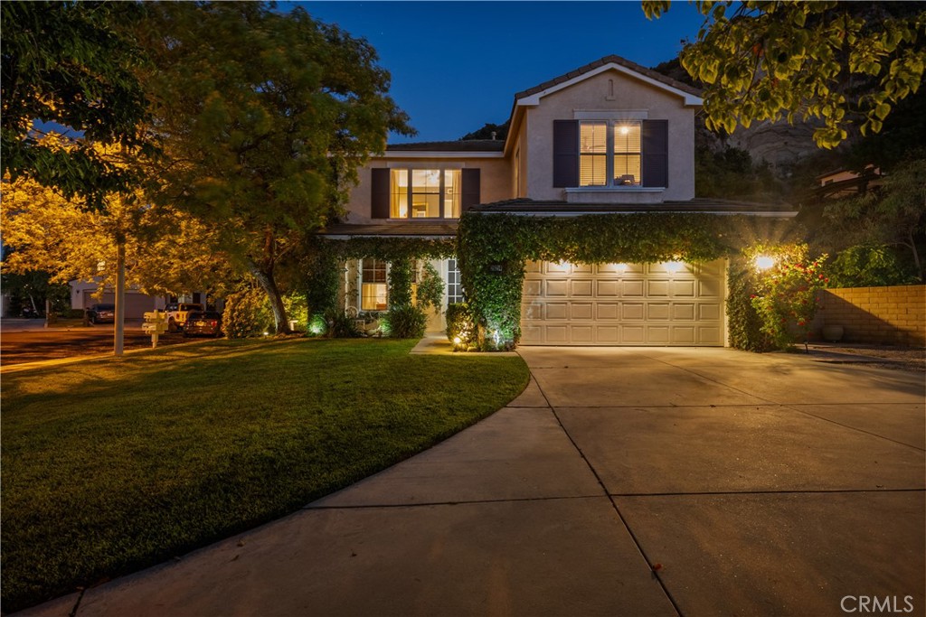 26214 Reade Place Stevenson Ranch, CA 91381 - Photo 49 of 58 a front view of a house with a yard