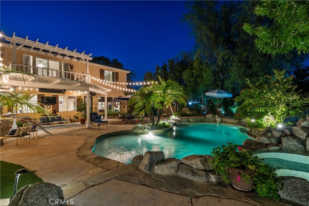 26214 Reade Place Stevenson Ranch, CA 91381 - Photo 53 of 58 a view of a swimming pool with a garden