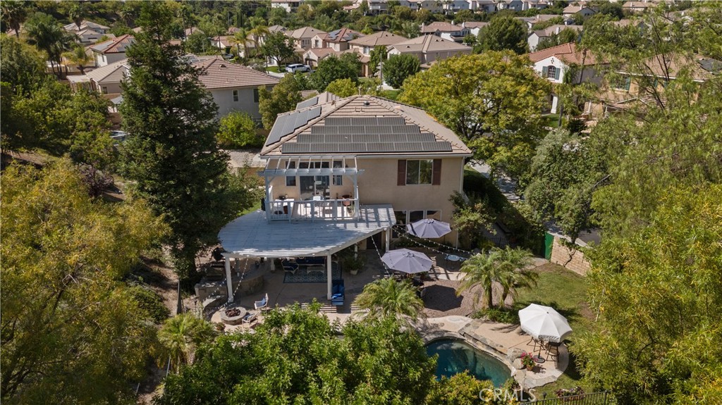 26214 Reade Place Stevenson Ranch, CA 91381 - Photo 9 of 58 an aerial view of a house with table and chairs and potted plants