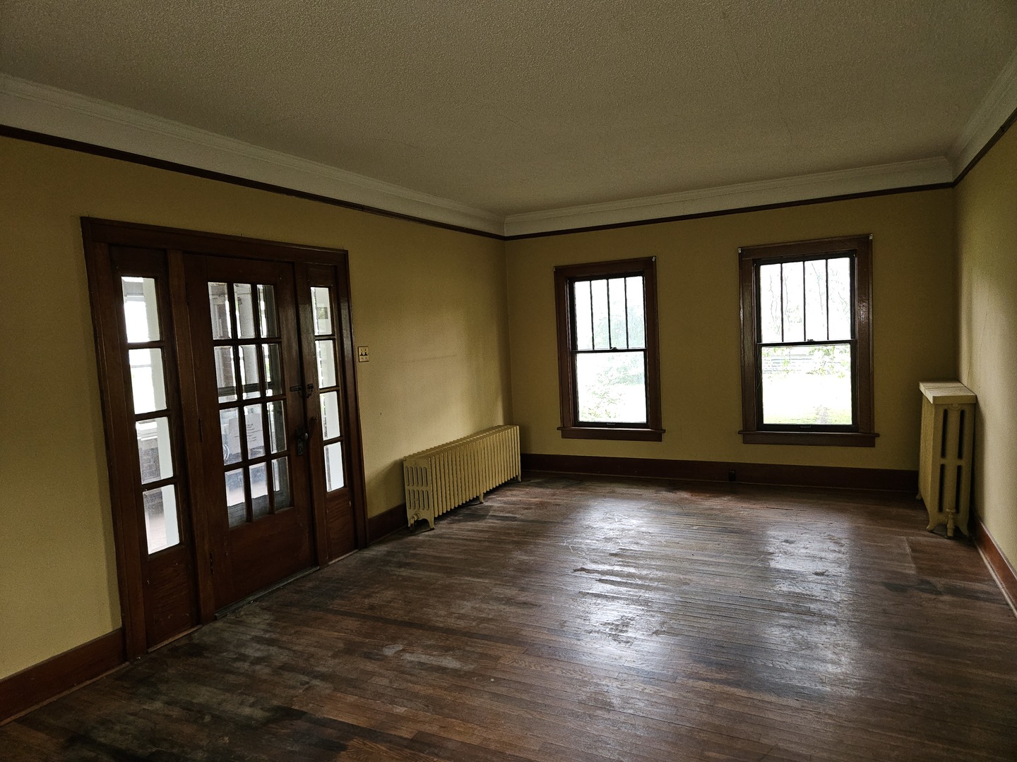402 East 5th Street Flora, IL 62839 - Photo 15 of 29 a view of an empty room with wooden floor and a window