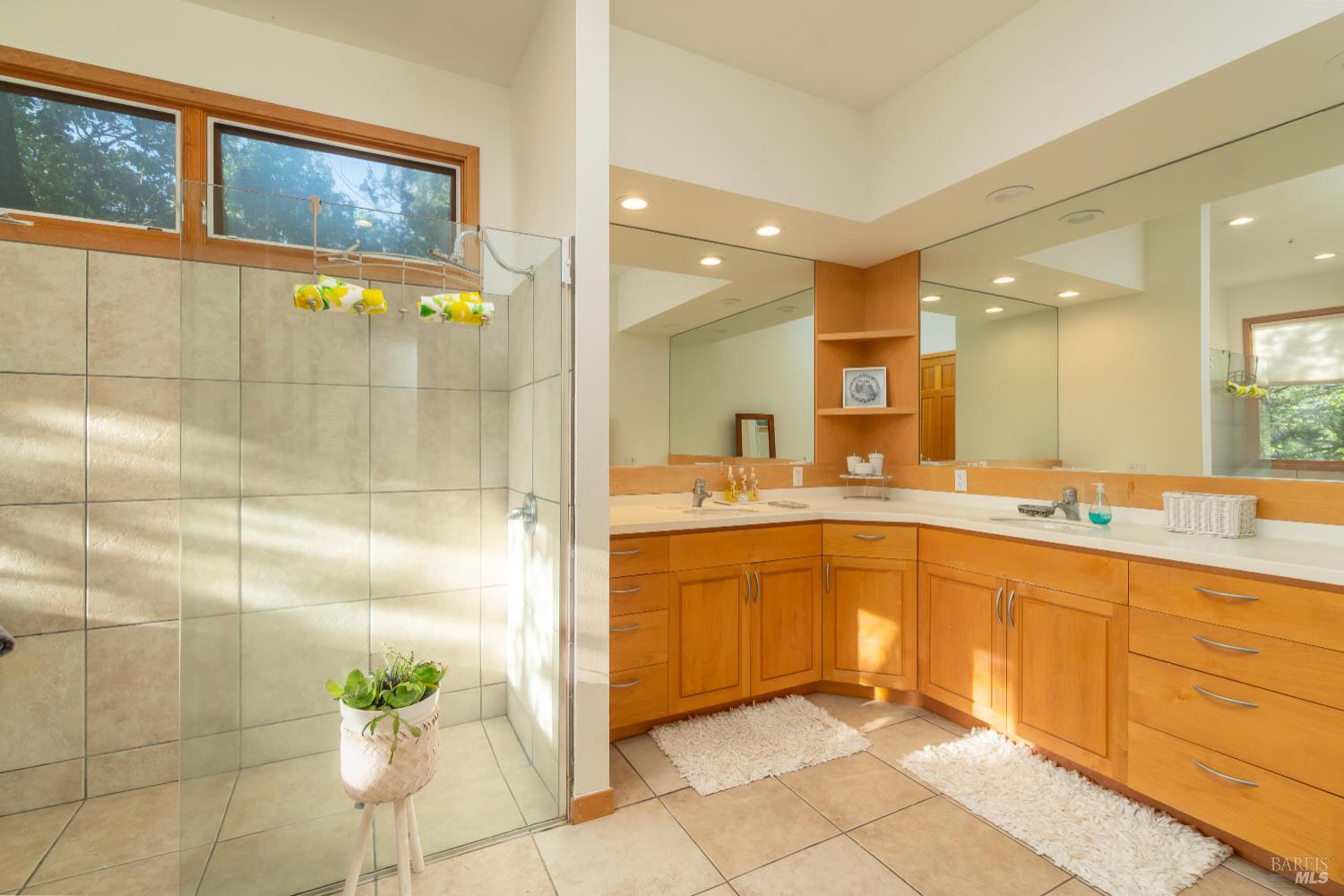 8 Circle Road San Rafael, CA 94903 - Photo 32 of 51 a large bathroom with a sink a counter top space and a mirror