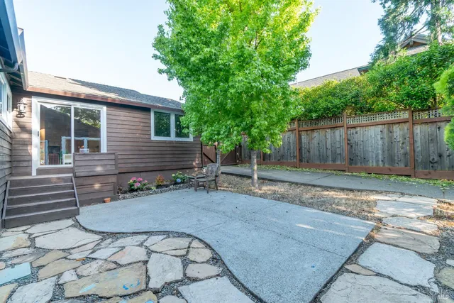 a backyard of a house with seating space