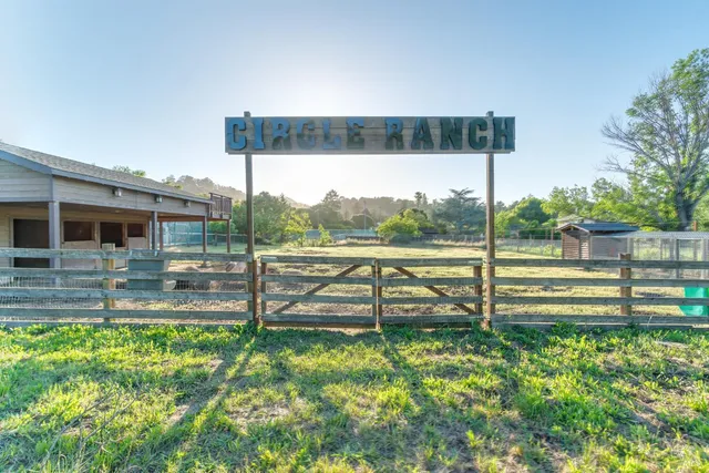 a swimming pool with outdoor seating and yard