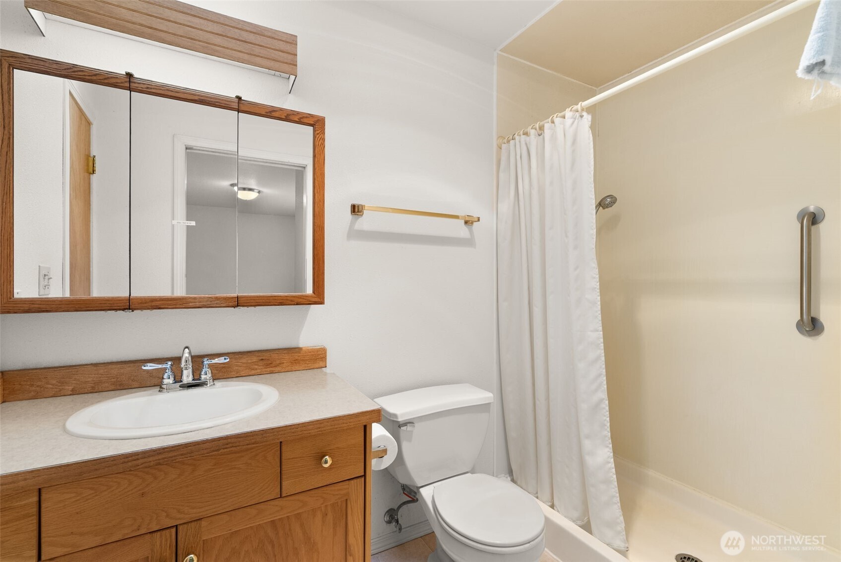 570 Wynoochee Valley Road Montesano, WA 98563 - Photo 12 of 28 a bathroom with a sink a toilet and shower