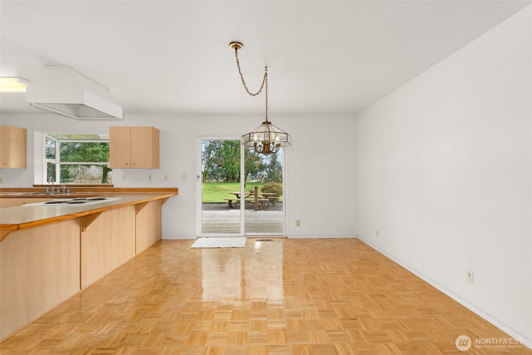 570 Wynoochee Valley Road Montesano, WA 98563 - Photo 5 of 28 a large white kitchen with a sink and a large window