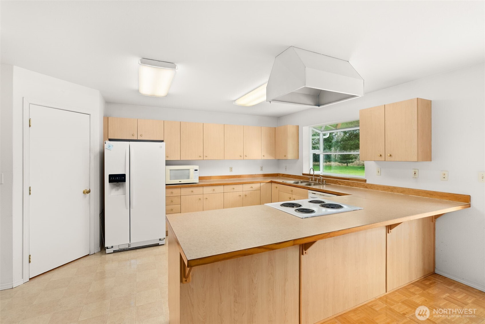 570 Wynoochee Valley Road Montesano, WA 98563 - Photo 6 of 28 a white refrigerator freezer sitting inside of a kitchen