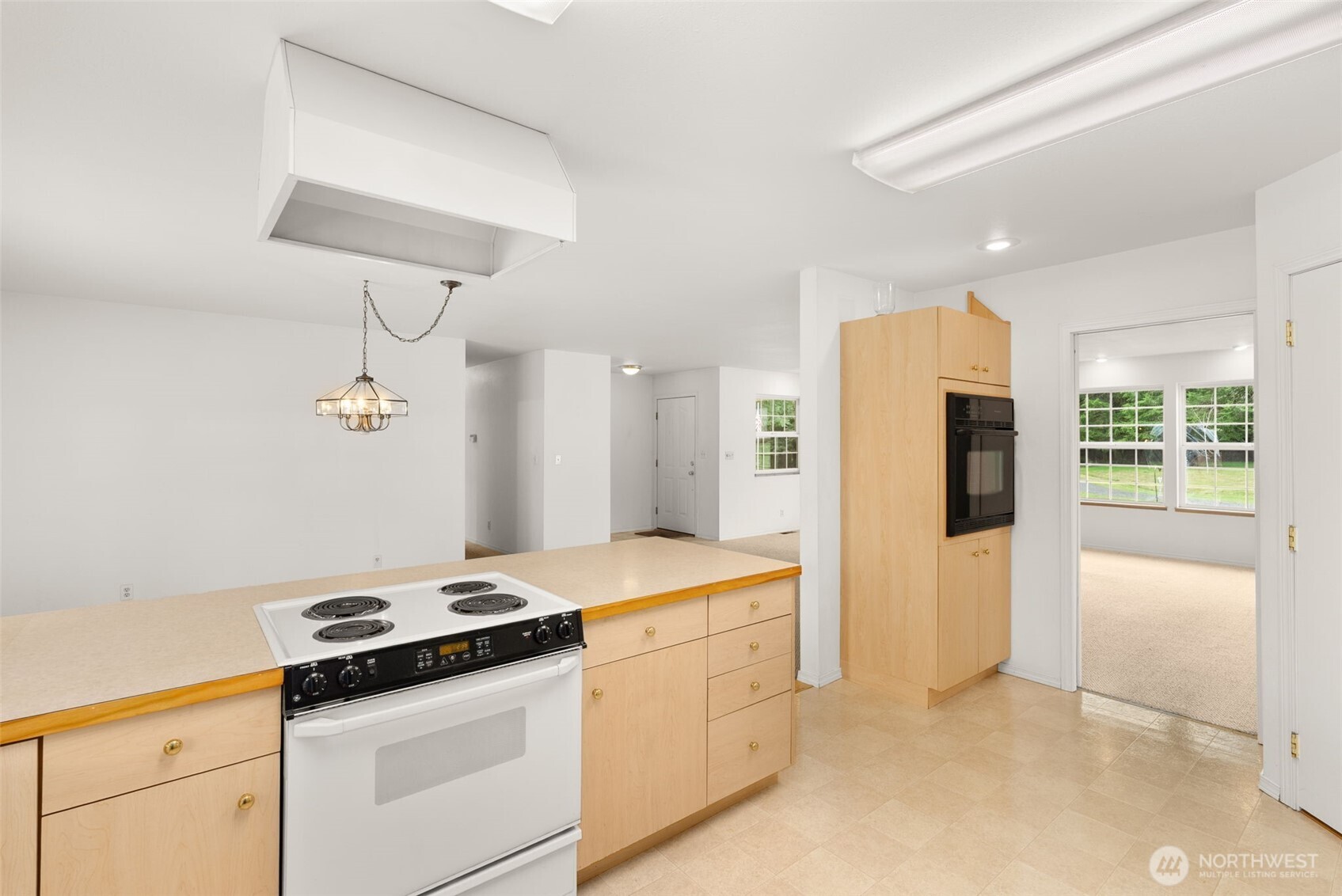 570 Wynoochee Valley Road Montesano, WA 98563 - Photo 8 of 28 a kitchen with a stove and a refrigerator