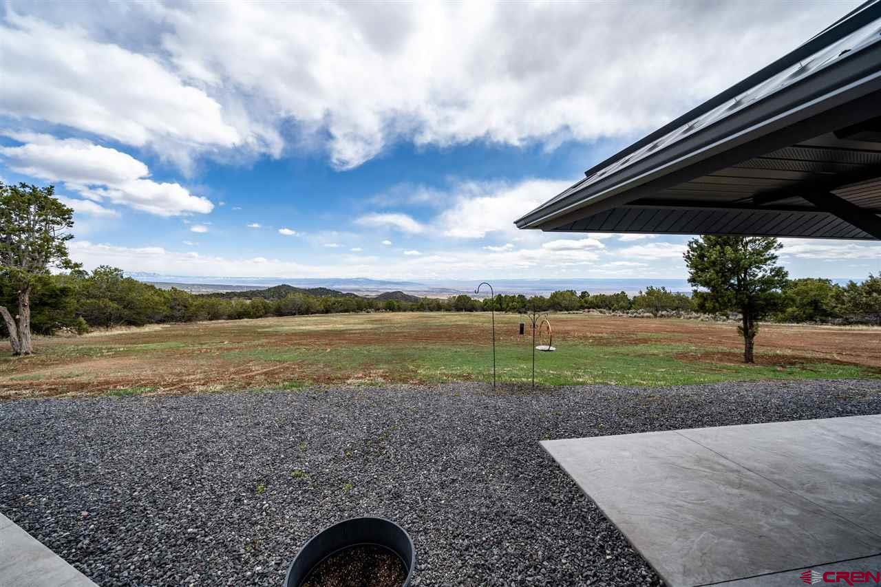 20885 Mesawood Road Cedaredge, CO 81413 - Photo 35 of 35 a view of a lake with a mountain