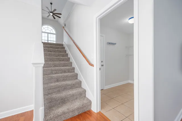 a view of entryway and hall with wooden floor