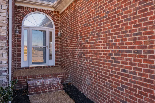 a view of a brick wall with a sink