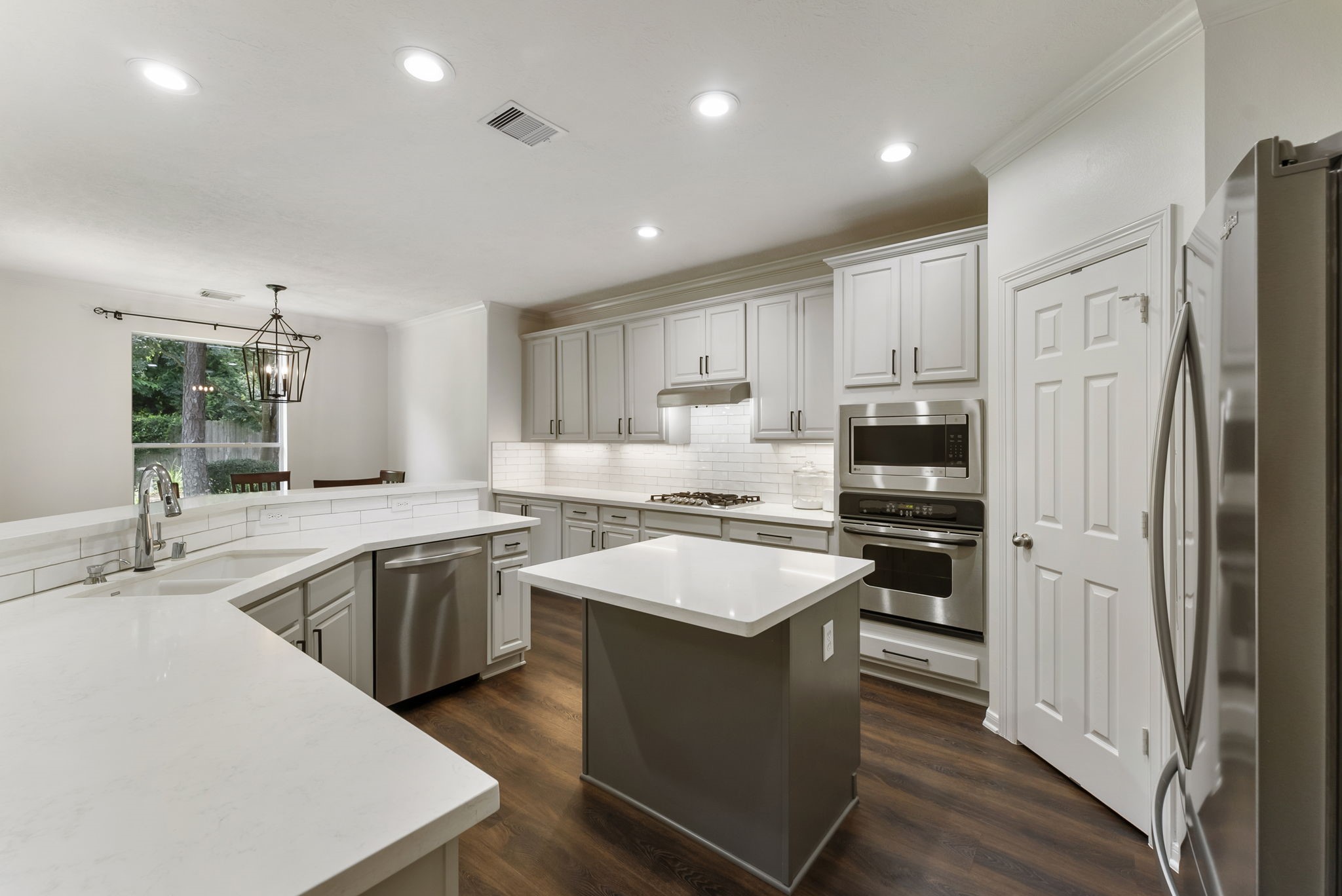 6643 Knollbridge Lane Spring, TX 77379 - Photo 9 of 50 The design of this kitchen was lead by an interior designer and also features a huge walk-in pantry.