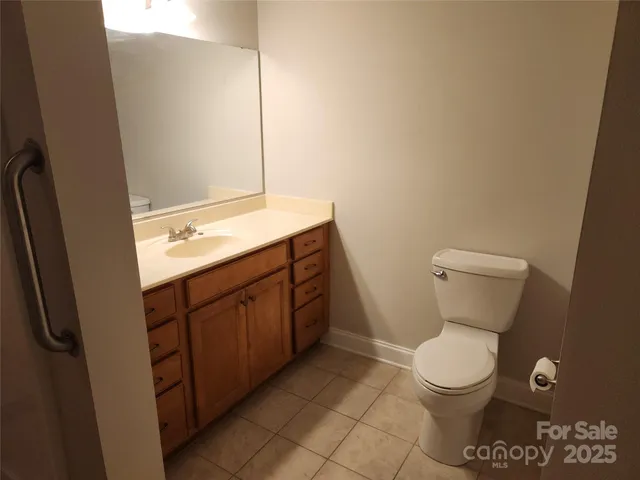 a patio with a table and chairs under an umbrella