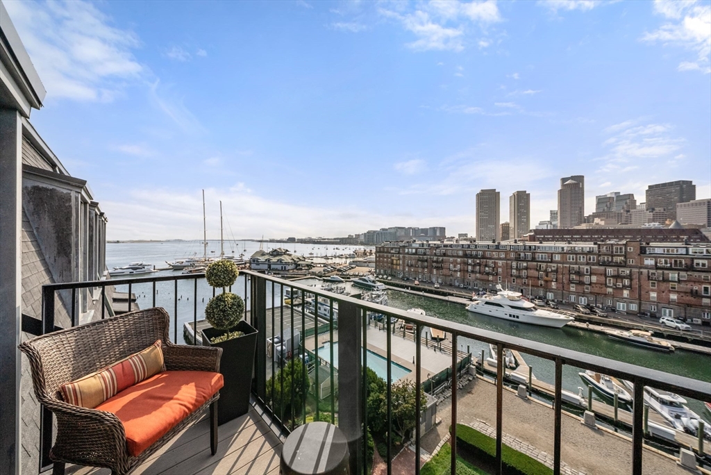 28 Atlantic Avenue, Unit 638 Boston, MA 02110 - Photo 15 of 39 a view of a balcony with two chairs and a table