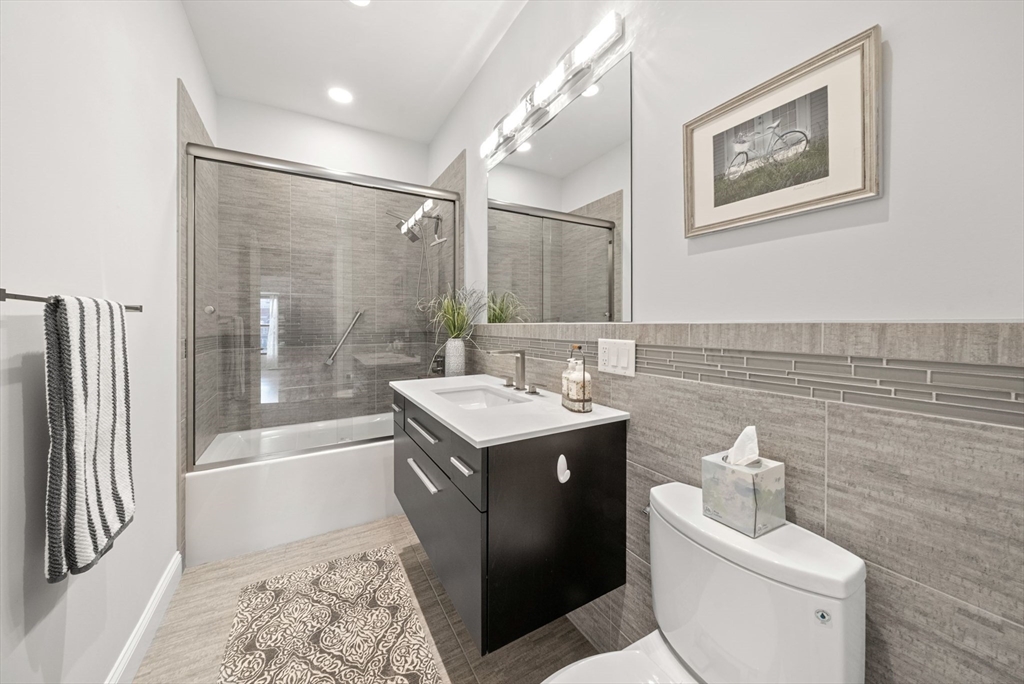 28 Atlantic Avenue, Unit 638 Boston, MA 02110 - Photo 19 of 39 a bathroom with a sink toilet and shower
