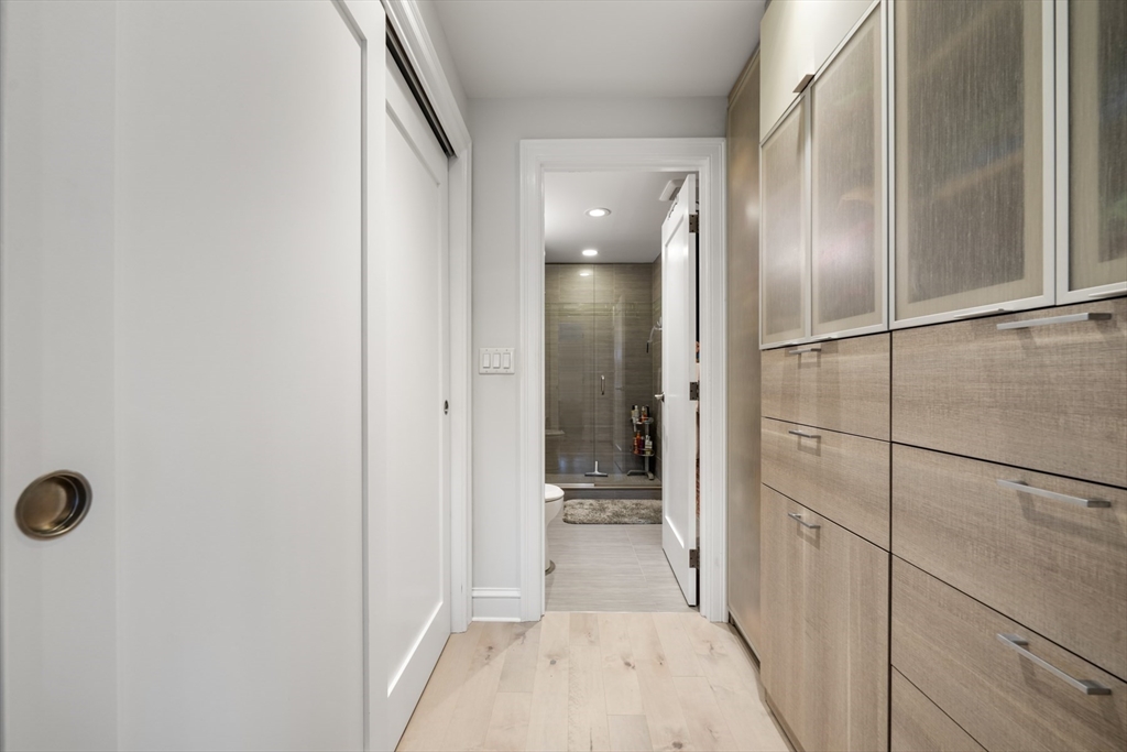 28 Atlantic Avenue, Unit 638 Boston, MA 02110 - Photo 28 of 39 a bathroom with a glass shower door