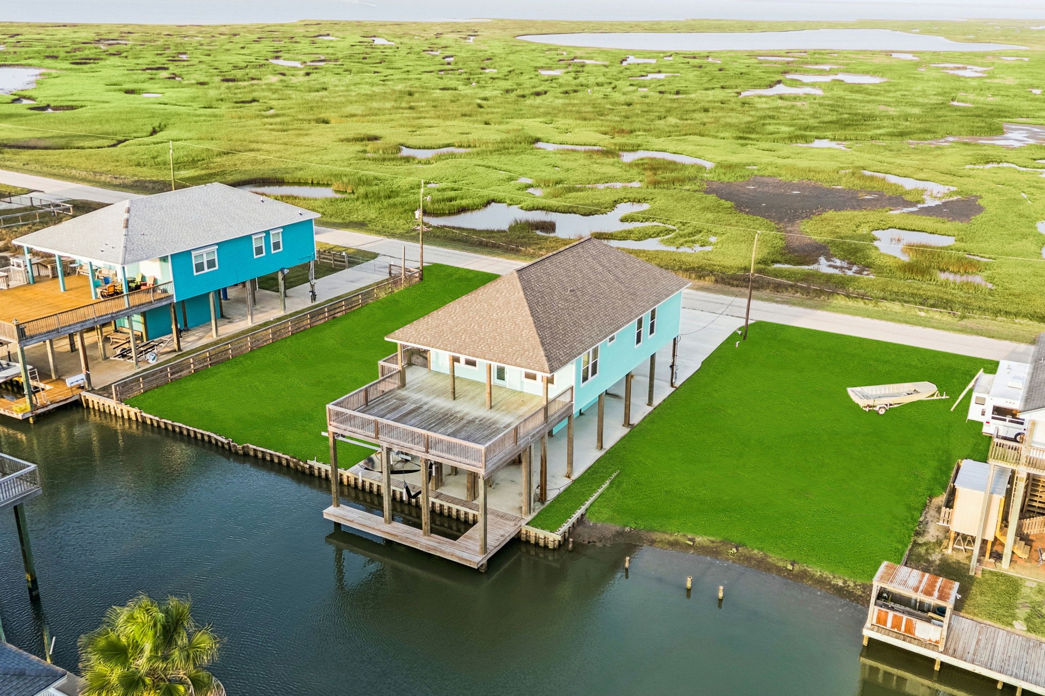 591 Pompano Lane Freeport, TX 77541 - Photo 18 of 23 an aerial view of residential houses with outdoor space and ocean view