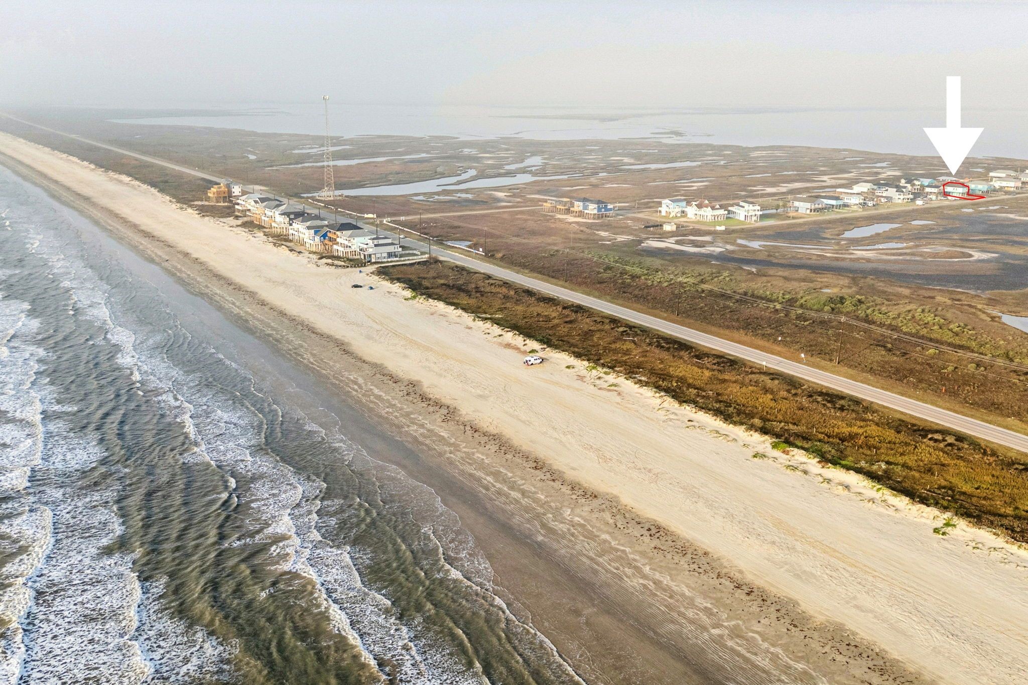 591 Pompano Lane Freeport, TX 77541 - Photo 21 of 23 a view of an ocean and beach