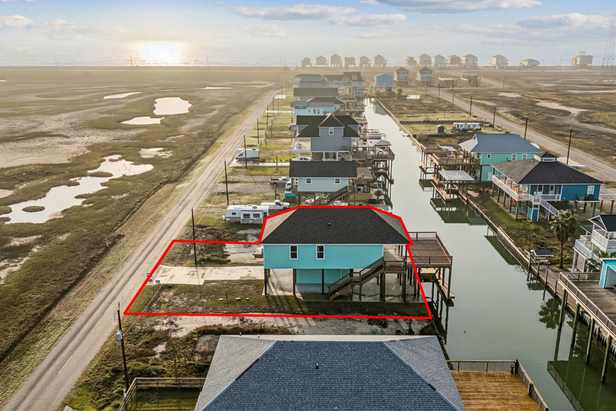 591 Pompano Lane Freeport, TX 77541 - Photo 22 of 23 a view of a city with an ocean