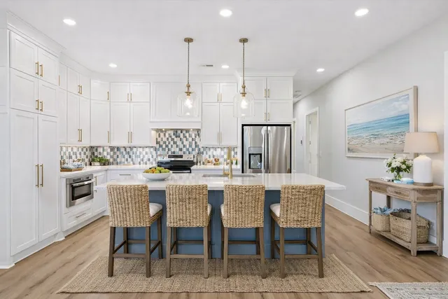 a large kitchen with a table and chairs