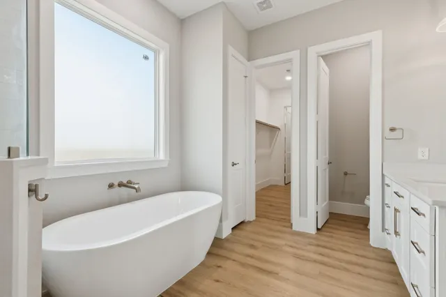 a bathroom with a bathtub and a sink