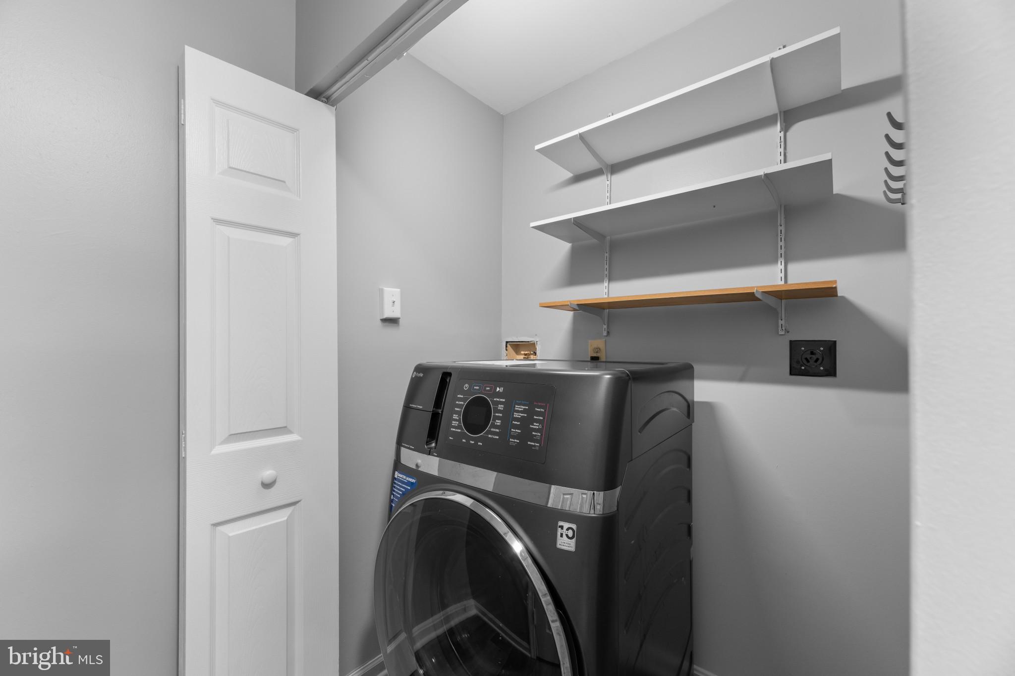 9302 Player Drive, Unit 155 Laurel, MD 20708 - Photo 17 of 43 a utility room with dryer and washer