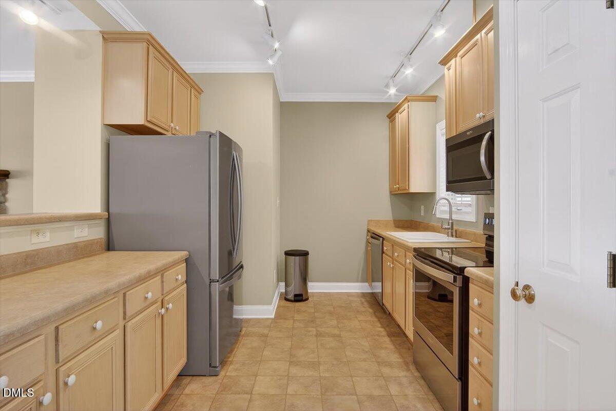 185 Joe Baldwin Road Leasburg, NC 27291 - Photo 13 of 95 a kitchen with stainless steel appliances granite countertop a refrigerator and a stove
