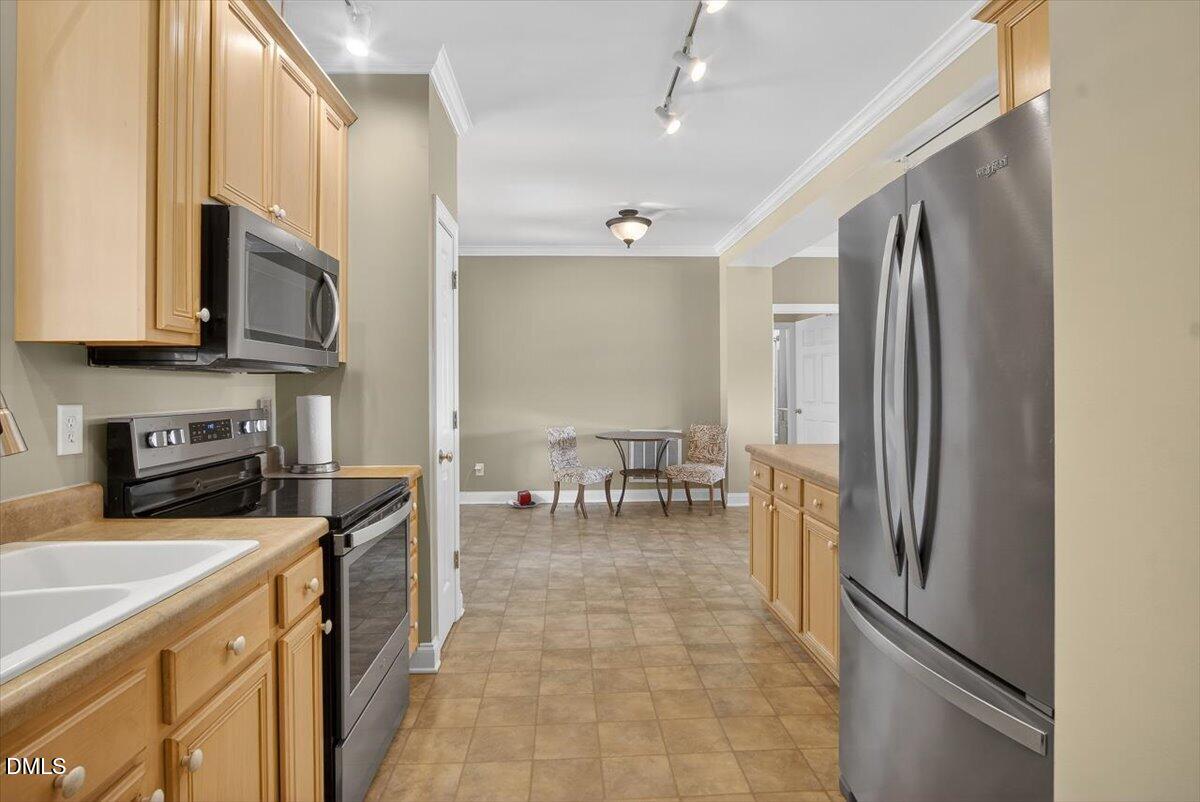 185 Joe Baldwin Road Leasburg, NC 27291 - Photo 16 of 95 a kitchen with stainless steel appliances granite countertop a refrigerator stove and sink