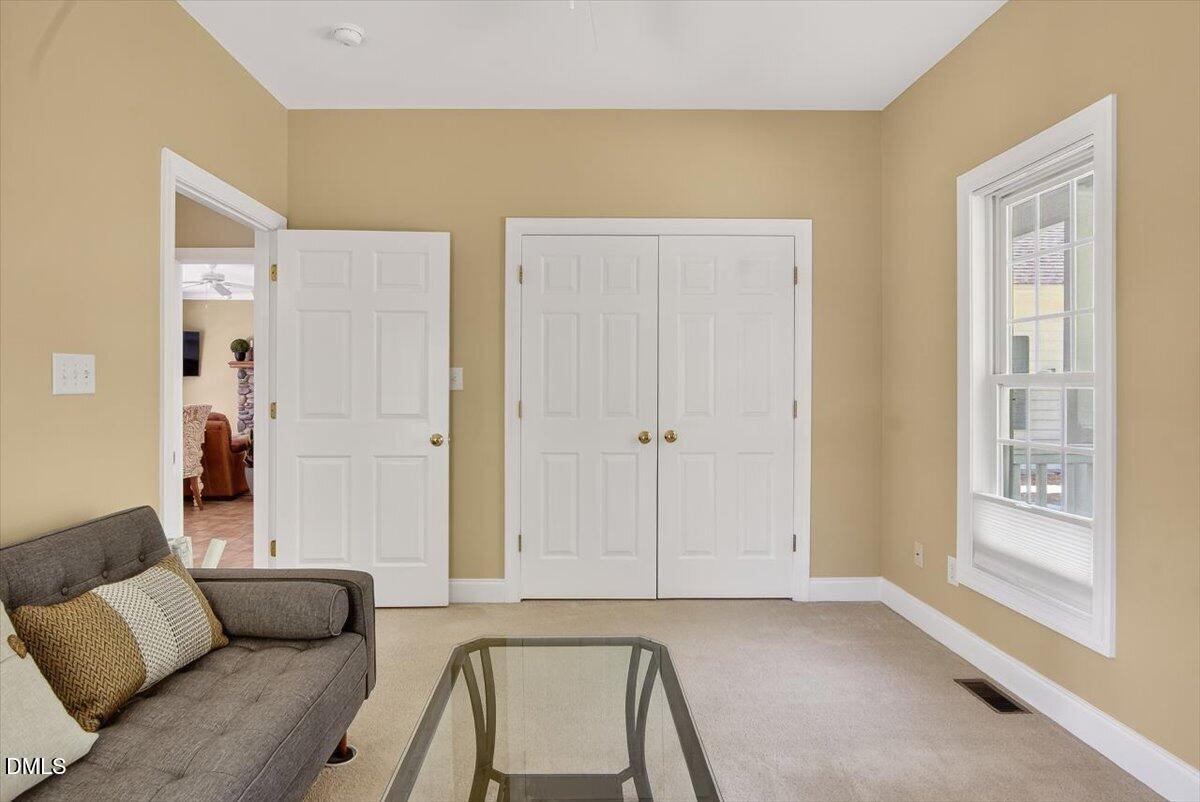185 Joe Baldwin Road Leasburg, NC 27291 - Photo 21 of 95 a living room with furniture and a window