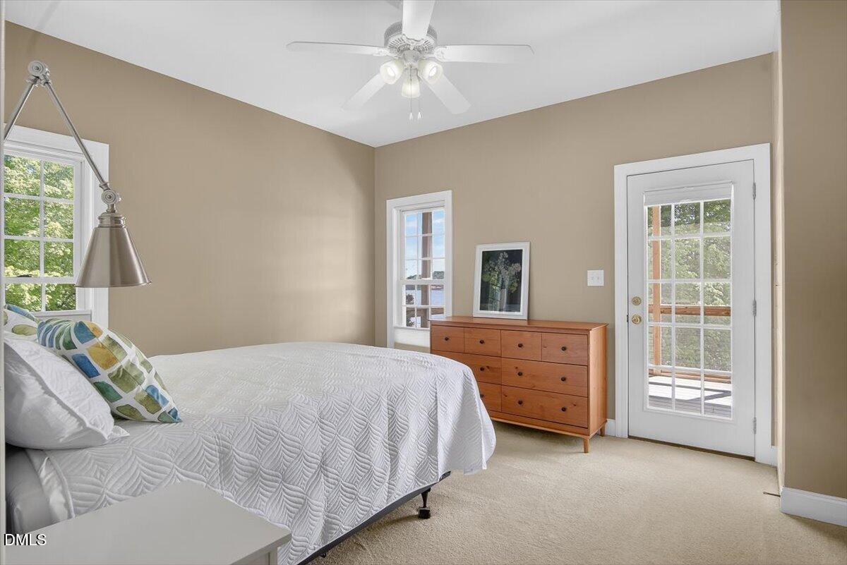 185 Joe Baldwin Road Leasburg, NC 27291 - Photo 24 of 95 a bedroom with a bed and a dresser