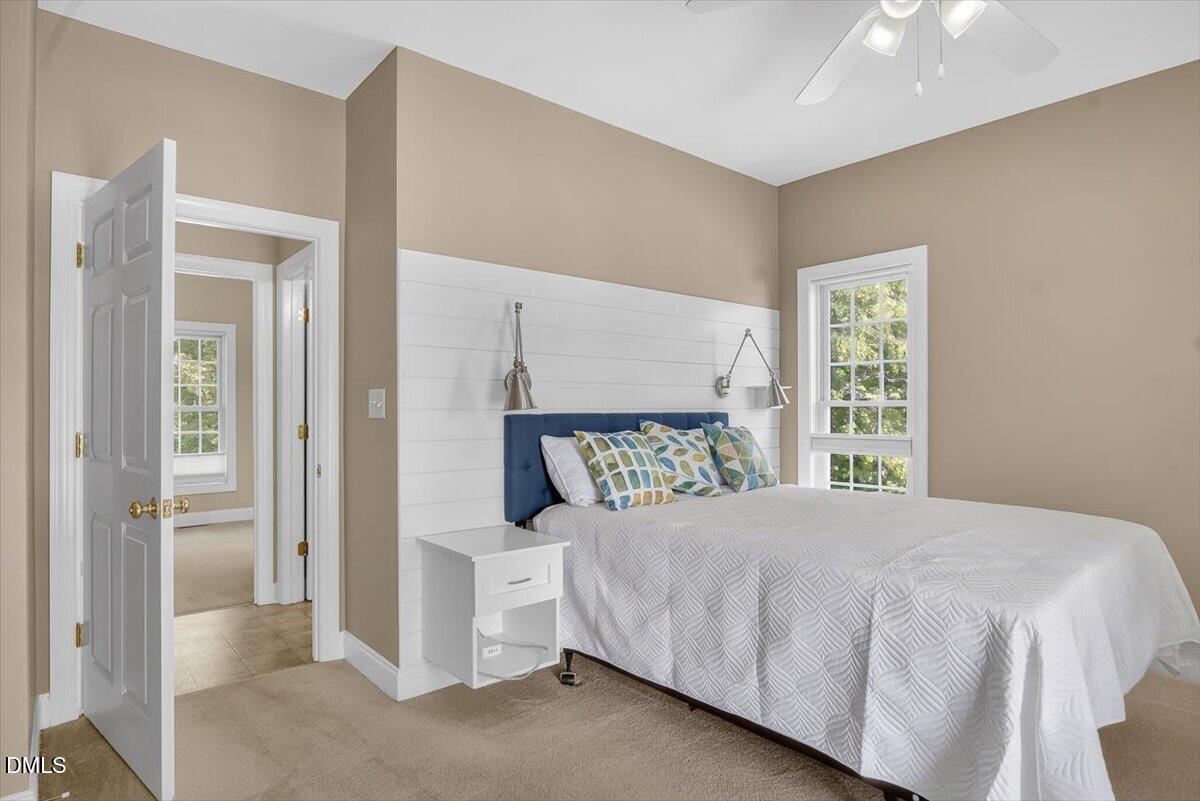 185 Joe Baldwin Road Leasburg, NC 27291 - Photo 25 of 95 a bedroom with a bed and a window
