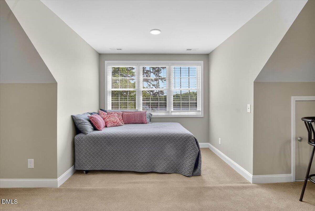 185 Joe Baldwin Road Leasburg, NC 27291 - Photo 41 of 95 a bedroom with a bed and a large window