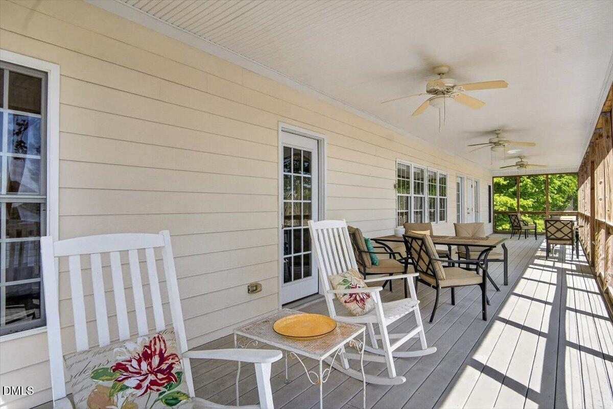 185 Joe Baldwin Road Leasburg, NC 27291 - Photo 63 of 95 a view of a dining room with furniture window and outside view