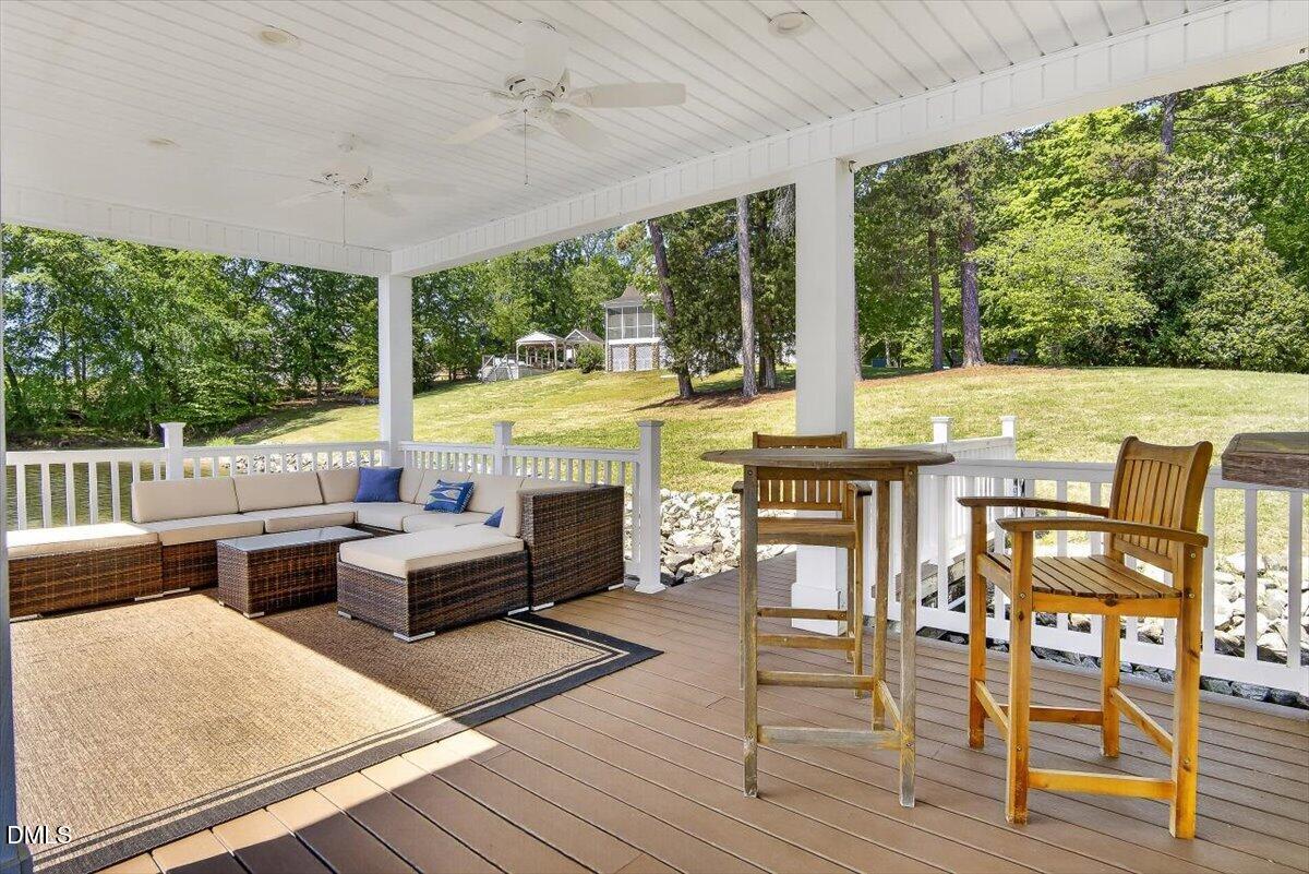 185 Joe Baldwin Road Leasburg, NC 27291 - Photo 71 of 95 a view of living room with patio furniture and floor to ceiling windows