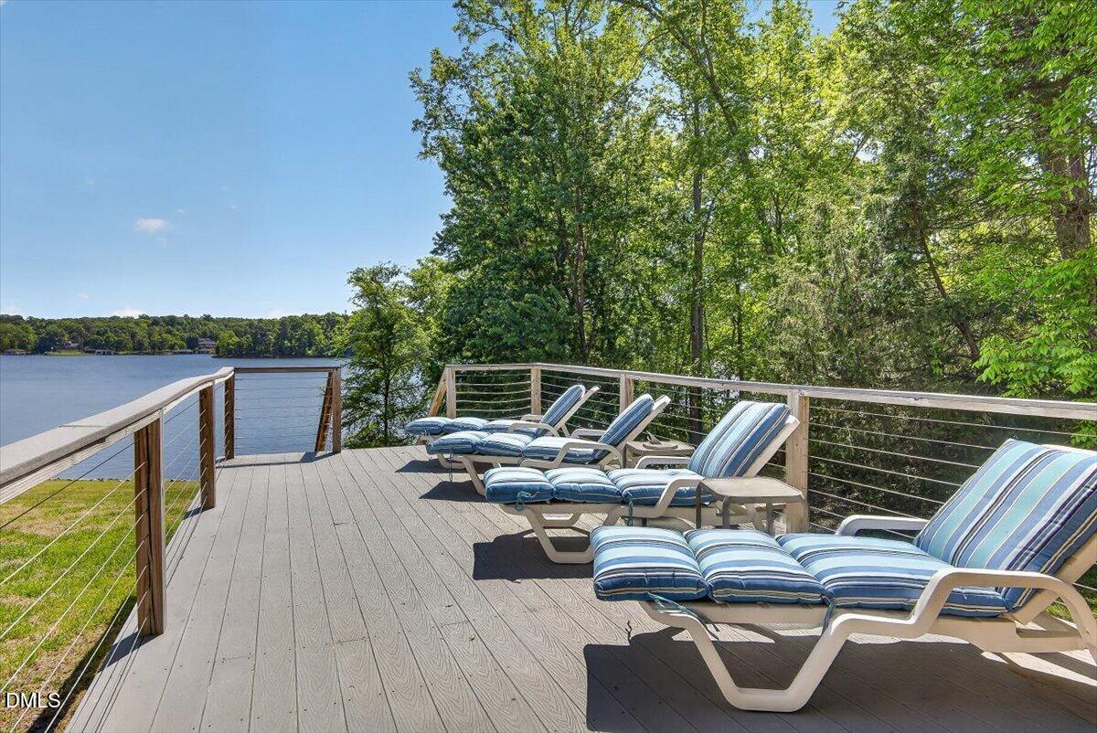 185 Joe Baldwin Road Leasburg, NC 27291 - Photo 77 of 95 a view of roof deck with chair and wooden floor