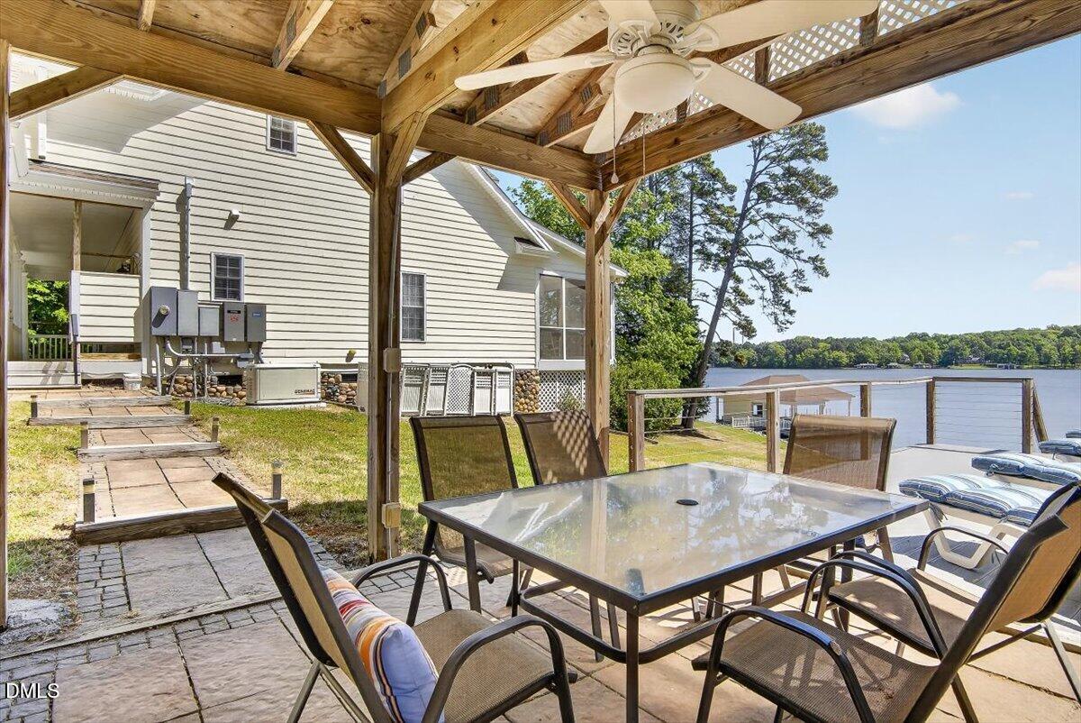185 Joe Baldwin Road Leasburg, NC 27291 - Photo 85 of 95 a view of a patio with a table and chairs