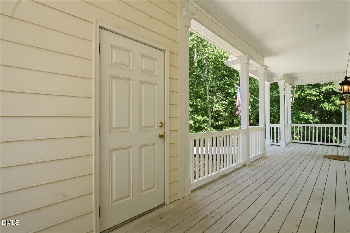 185 Joe Baldwin Road Leasburg, NC 27291 - Photo 92 of 95 a view of a balcony with wooden floor