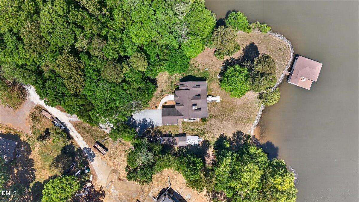 185 Joe Baldwin Road Leasburg, NC 27291 - Photo 7 of 95 an aerial view of a house with a yard and plants
