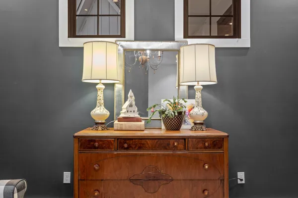 a dining room with furniture a livingroom and chandelier