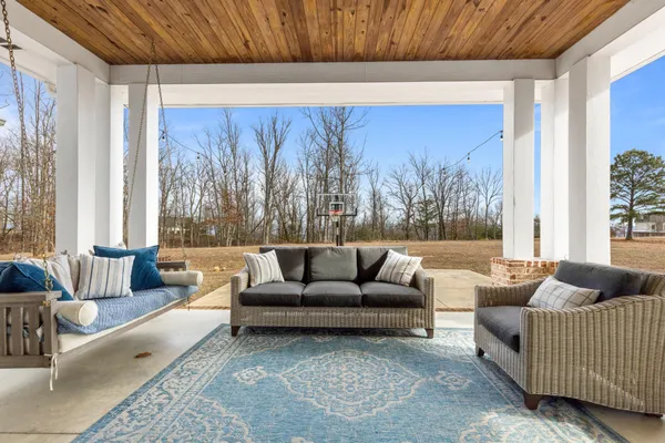 a bedroom with a bed and a night stand